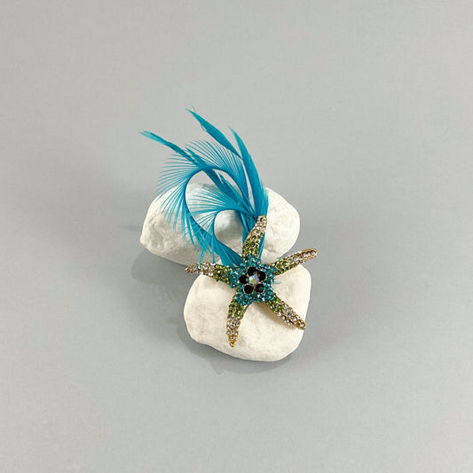 Broche Estrella de mar y plumas